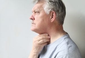 man with throat pain